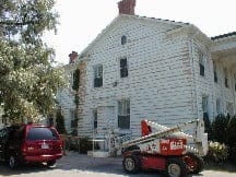 painters toronto rent a crane to paint an exterior house toronto exterior painters paint a building